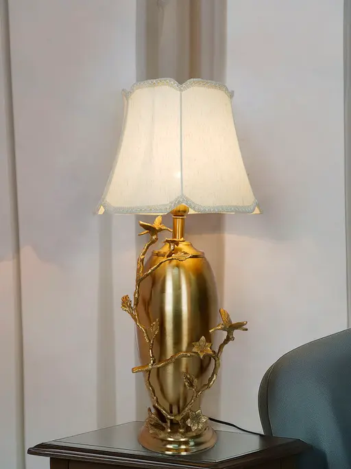 Golden Bird and Twig Table Lamp with Scalloped Cream Shade