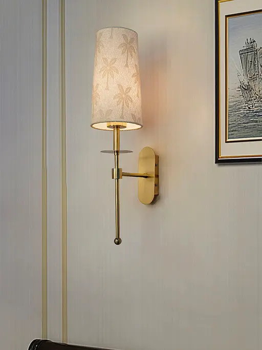 Antique Brass Long Arm Wall Sconce with Palm Motif Shade